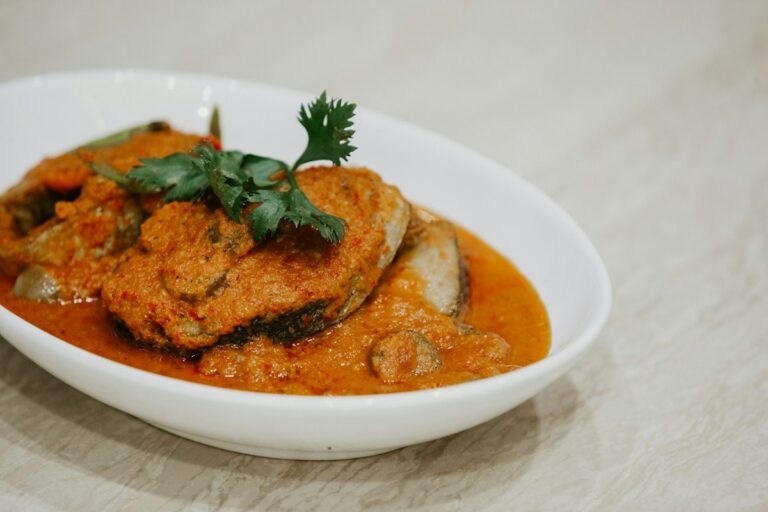 Illustrative photo of fish steaks in an orange coconut curry