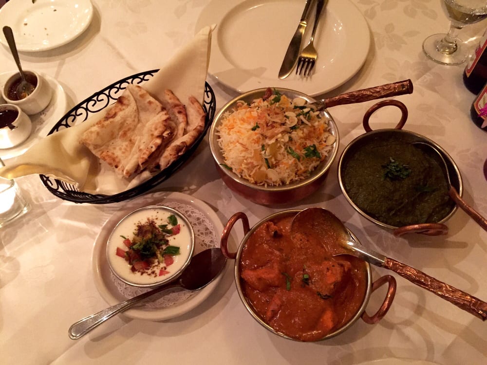Biryani, curry, saag, naan and raita served at UTSAV