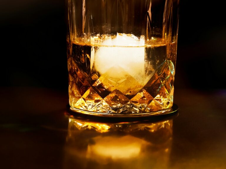 Illustrative photo of whisky in a crystal glass with an ice sphere